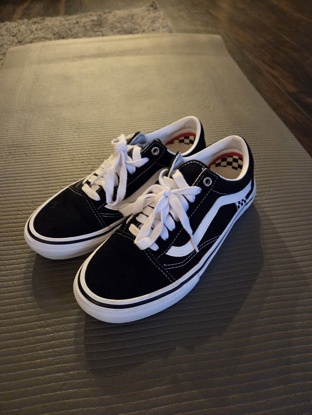 Vans Black and White Low-Top Skate Shoes with Red Heel Accent